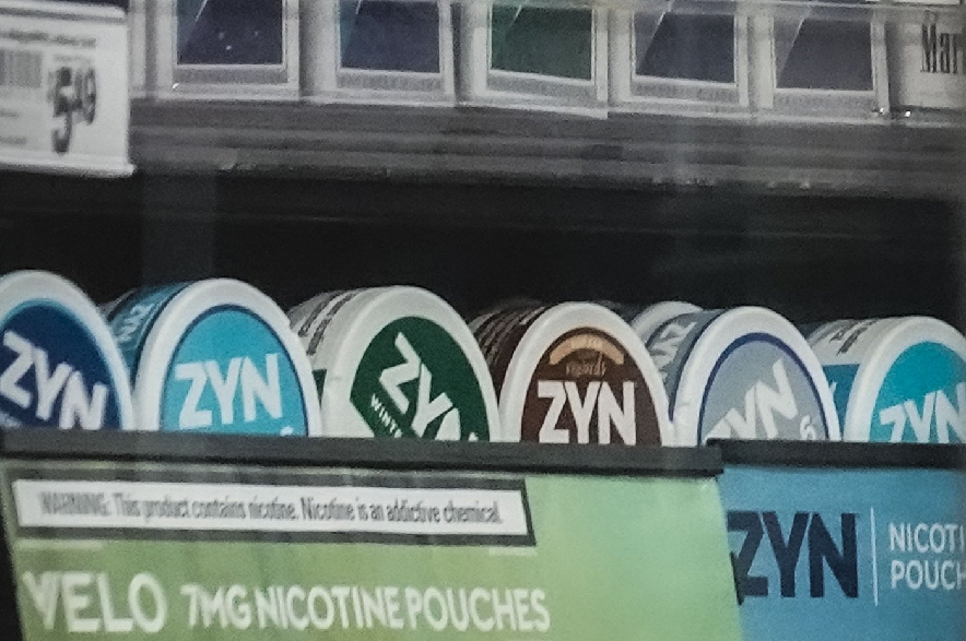 Containers of Zyn, a smokeless nicotine pouch, are displayed for sale among other nicotine and tobacco products at a newsstand on Feb. 23, 2024, in New York.