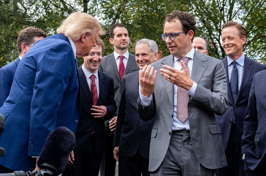 President Donald Trump, left, looks at Dario Amodei, CEO and co-founder of Anthropic as he speaks with reporters outside the West Wing of the White House, Tuesday, Sept. 29, 2026, in Washington.