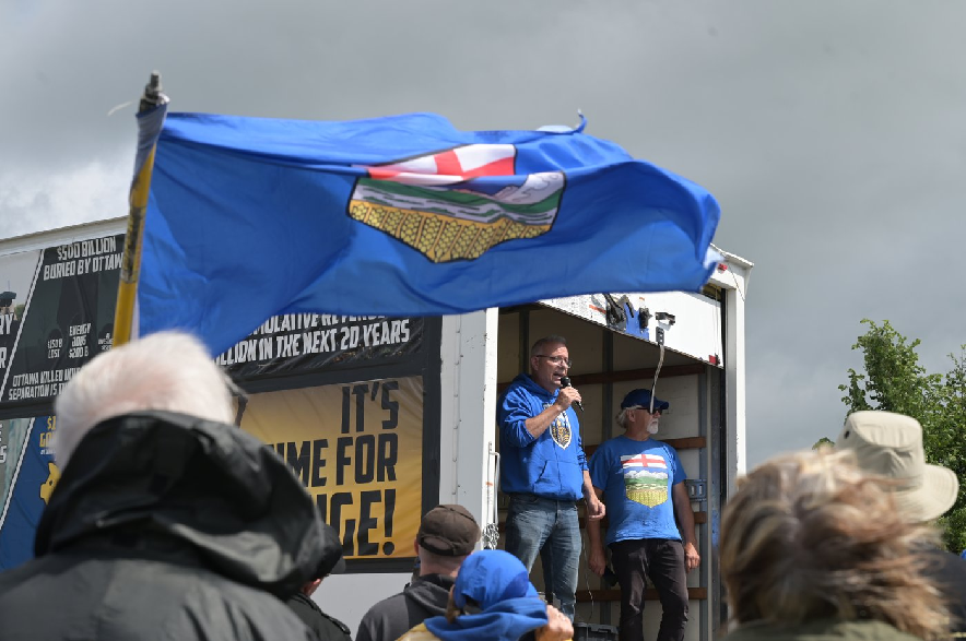 Cory Morgan speaks to supporters during an Alberta independence rally in Taber, Alta., on Sunday, June 28, 2026.