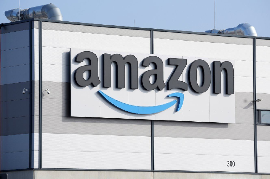 An Amazon company logo marks the facade of a building, March 18, 2022, in Schoenefeld near Berlin.