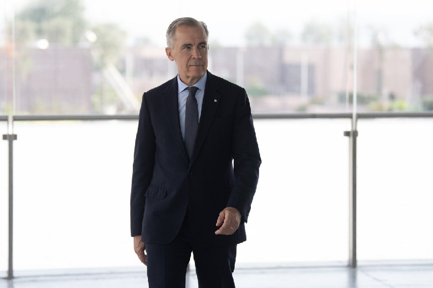 Prime Minister Mark Carney walks to a news conference in Istanbul, Turkey Friday, Oct. 23, 2026.