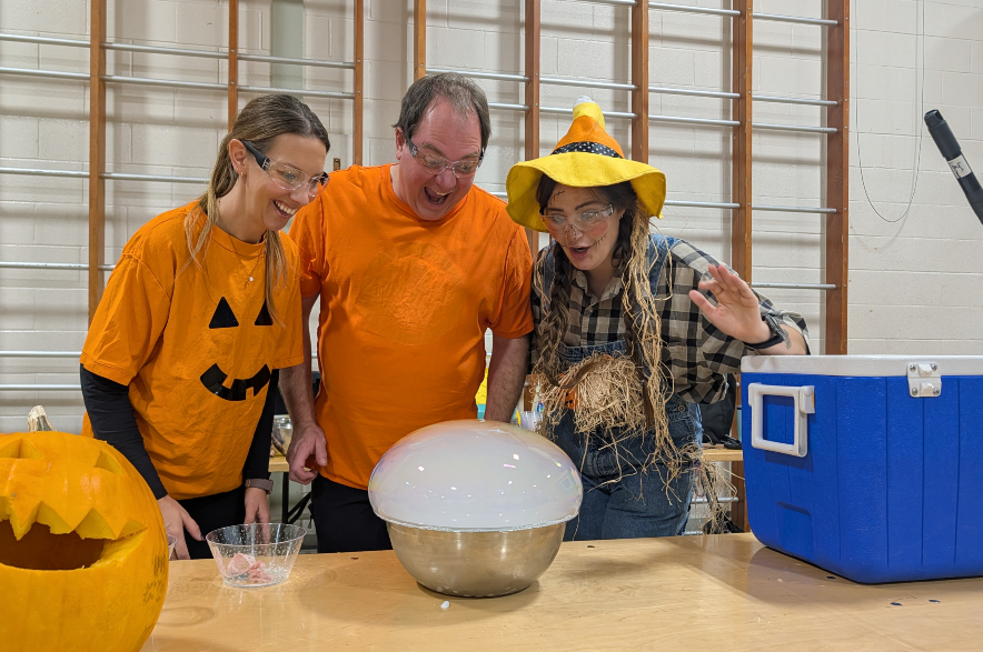 teachers Jacqueline Konechny, Brad Watts, and Mandy Cooper observe their dry ice demonstration at Buena Vista School.