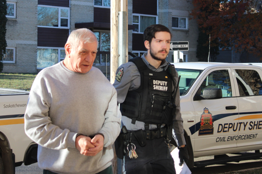Reg Durocher arriving at court in Prince Albert.