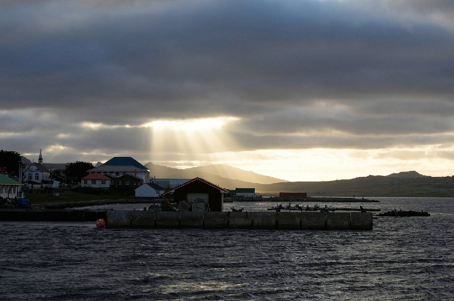 Sunlight breaks through the clouds over Stanley on the Falkland Islands, March 14, 2026.