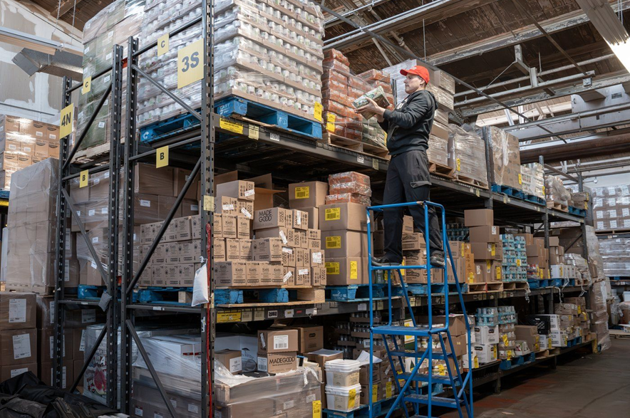 Victor stocks shelves at the North York Harvest Food Bank in Toronto on Tuesday Oct. 20, 2026.