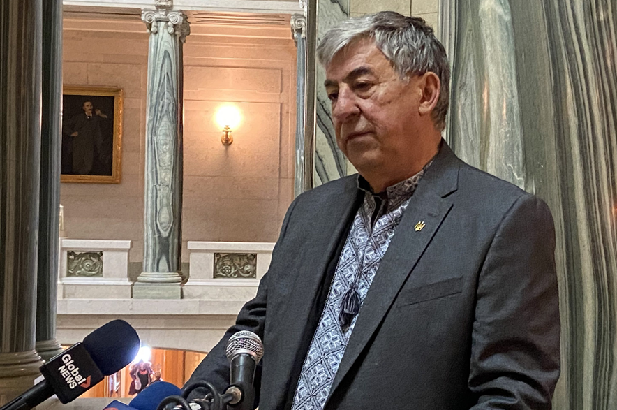 Ken Krawetz speaking to reporters in Regina in 2024.