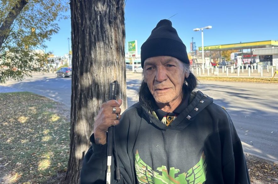 David Fineday stands outside of his apartment building after visiting his new home for the first time on Oct. 15, 2026. (Libby Gray/650 CKOM)
