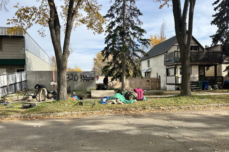 Avenue K curbs on on Oct. 9, 2026 hold various items from the encampment.