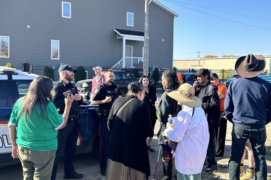 David Fineday speaks to police, surrounded by supporters of the encampment, on Sept. 24, 2026. (Libby Gray/650 CKOM)