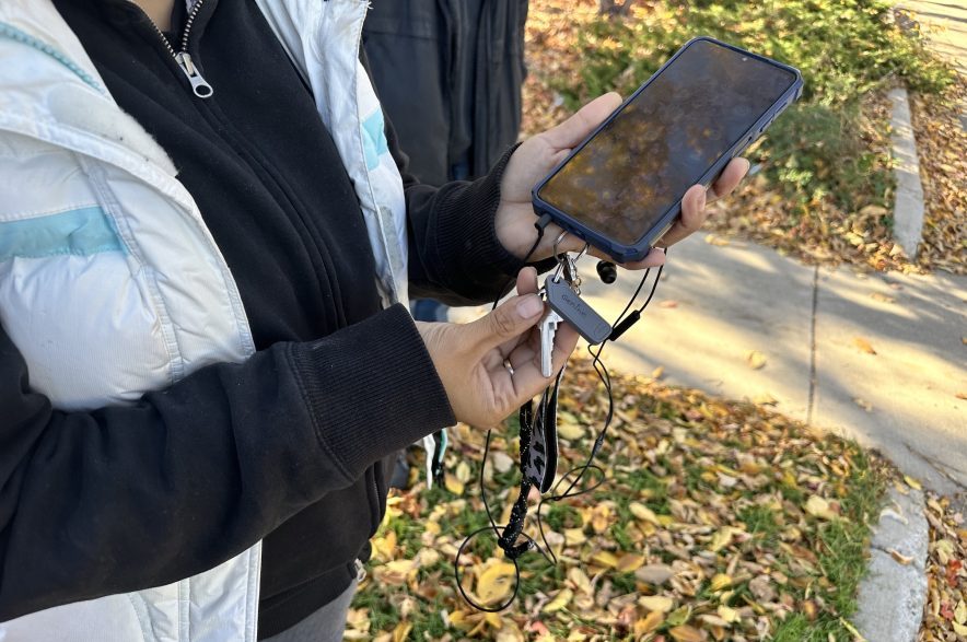 Genine Okanee proudly shows off the fob to her new apartment after spending the past two years living on the streets of Saskatoon with her partner. (Libby Gray/650 CKOM)