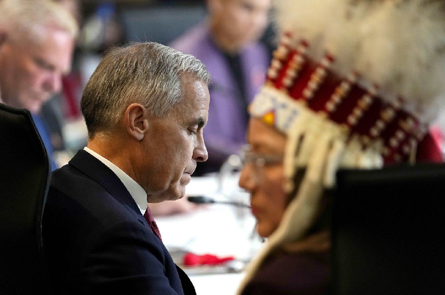 Prime Minister Mark Carney and National Chief of the Assembly of First Nations Cindy Woodhouse Nepinak participate in a First Nations and First Ministers Meeting in Ottawa, on Monday, Oct. 26, 2026.