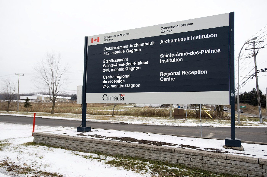 A Correctional Services Canada sign points the way to the federal prison at Ste-Anne-des-Plaines near Montreal on Tuesday, Nov. 30, 2010.