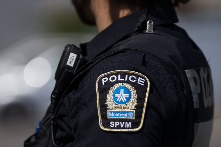 An SPVM shoulder insignia is seen on an officer's uniform in Montreal on Thursday, Aug. 29, 2024.