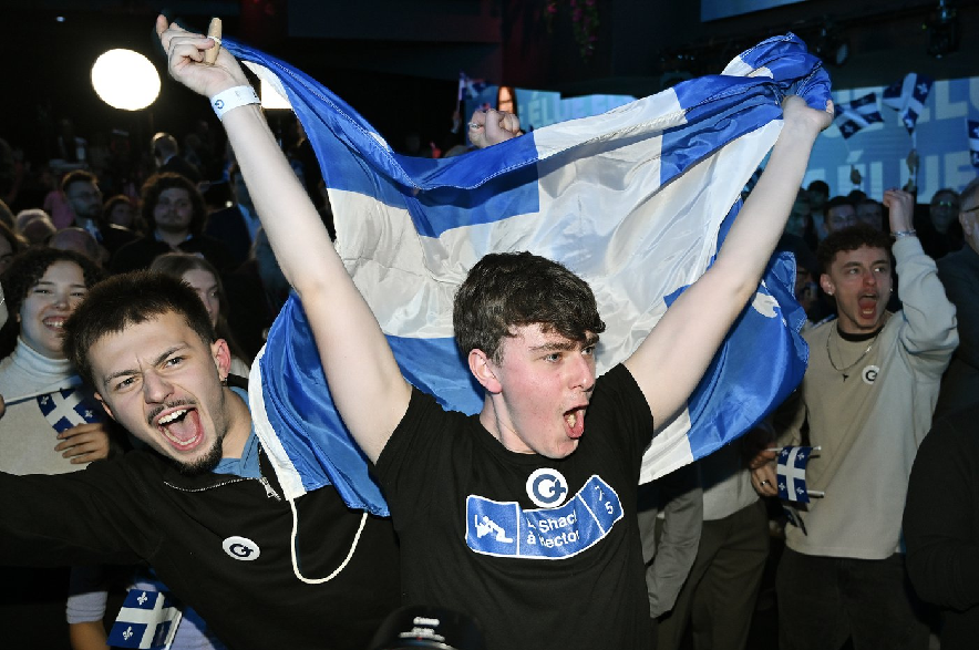 Parti Québécois supporters cheer as results come in at PQ headquarters on election night in Montreal, on Monday, Oct. 5, 2026.