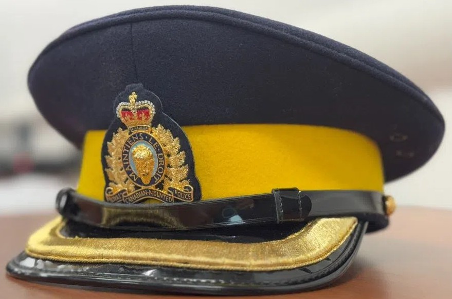 An RCMP officer's uniform hat sitting on a desk.