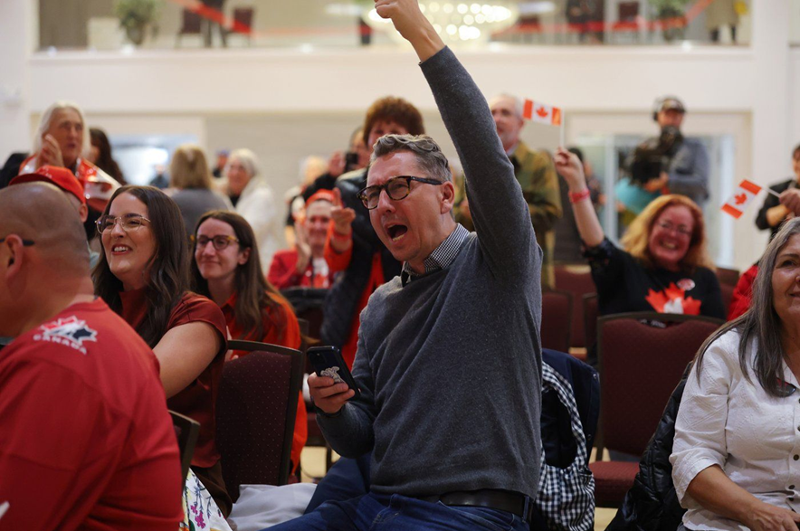 Supporters cheer as results begin to display at the pro Canada watch party in Edmonton, Monday, Oct. 19, 2026.