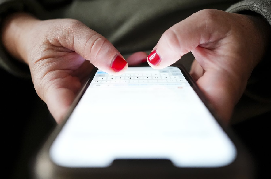A person types on a cellphone in Ottawa on Dec. 15, 2025.