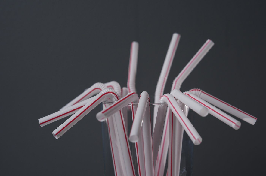 Plastic straws are displayed in a glass, Tuesday, Feb. 11, 2025, in Cincinnati.