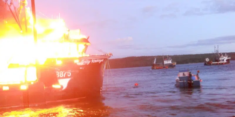 Locals Tow Burning Fishing Vessel Away from Port Saunders Wharf to Limit Damage