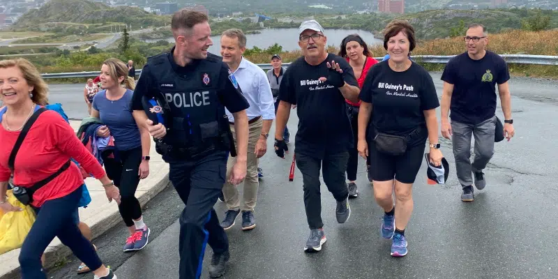 Surrounded by Supporters 'Push Up Man' Bill Guiney Finishes Cross-Island Walk for Mental Health
