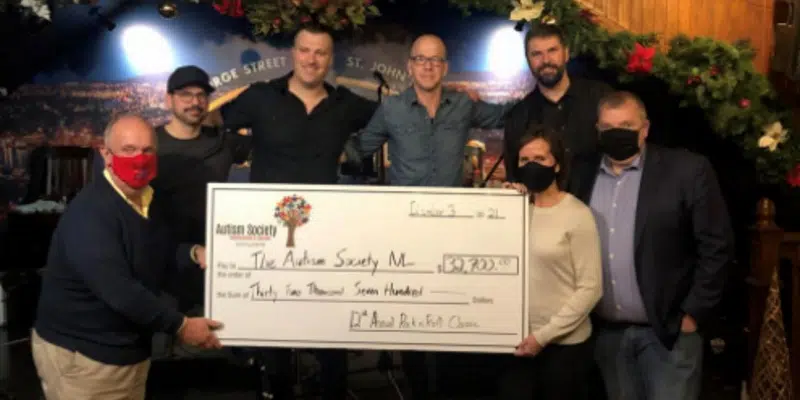 Autism Society Receives Donation From Local Band