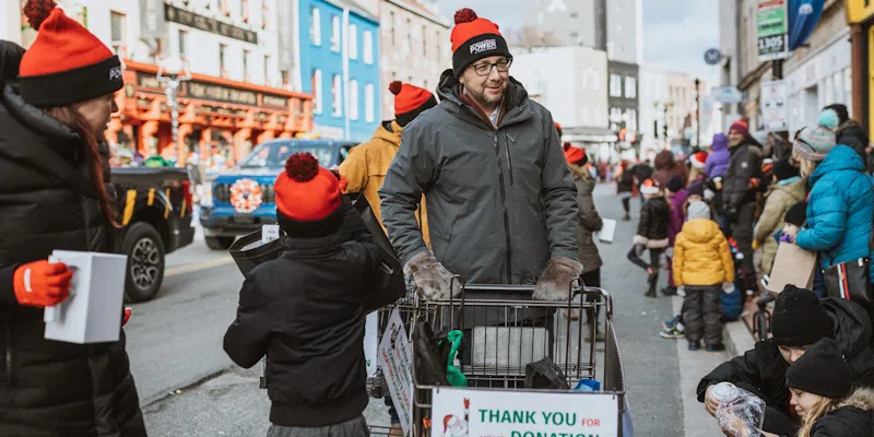 Downtown Santa Claus Parade Raises $65,000 in Food and Funds for Local Food Banks