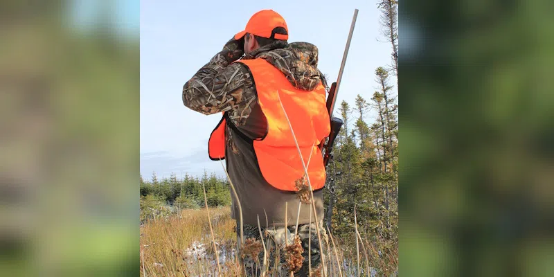 A hunter wears Blaze Orange to stay visible and safe during the hunting season.