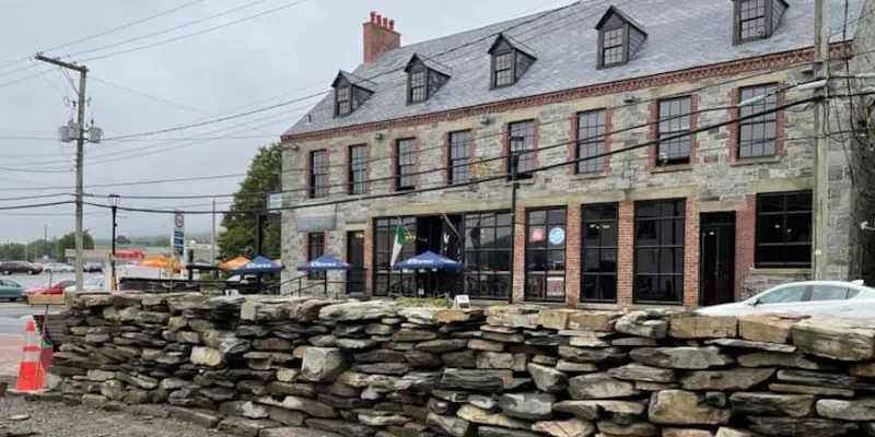 The town of Carbonear's stone wall and the Stone Jug on Water Street (Landscape NL)