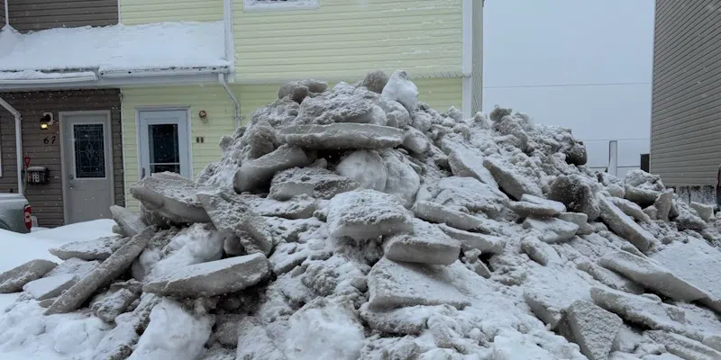 Woman Encounters Mounds of Ice at Foot of Driveway