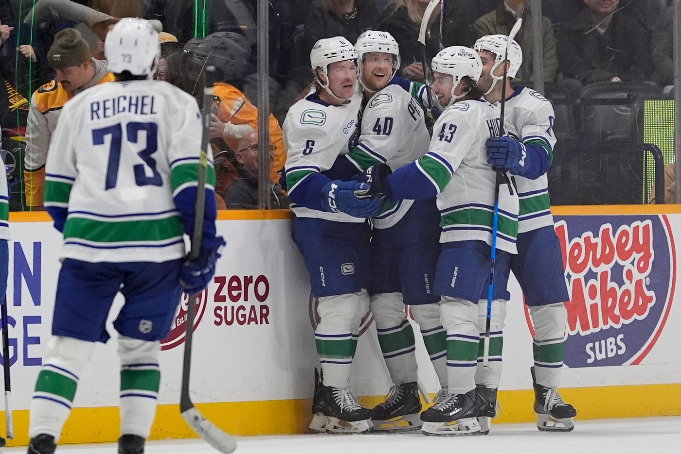 Brock Boeser celebrates overtime goal